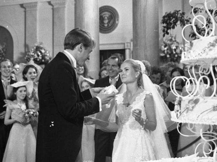 The new couple enjoyed their wedding cake at their reception inside the East Room of the White House, surrounded by nearly 400 guests.