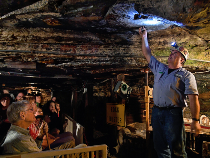 Visitors travel 1,500 feet beneath the ground on "mine cars" in a tour guided by veteran miners, she said.