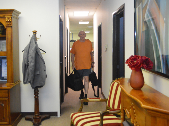 At 4:25 p.m., Caballero gets ready for his workout at a local gym near the office, where he works out three times per week.