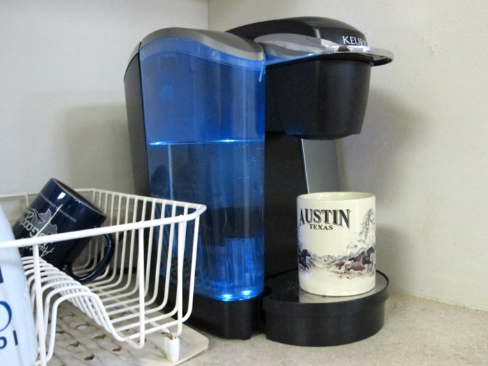 After getting to his office and saying "hello" to his team, the first thing Caballero does is grab a cup of coffee with honey in one of his favorite mugs.