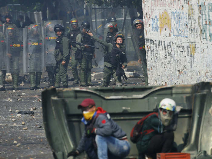 Torres was one of nine defected guardsmen who spoke to the AP, saying they were ordered to prevent aid from crossing the border. Fearing reprisals by their commanders — including jail or torture — some complied, launching tear gas at protestors.