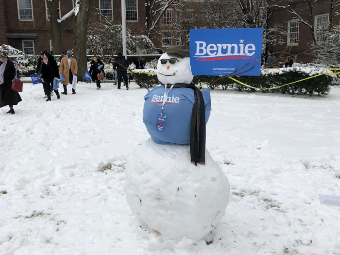 Attendees and volunteers made the best of the inclement weather, building a snowman in Sanders