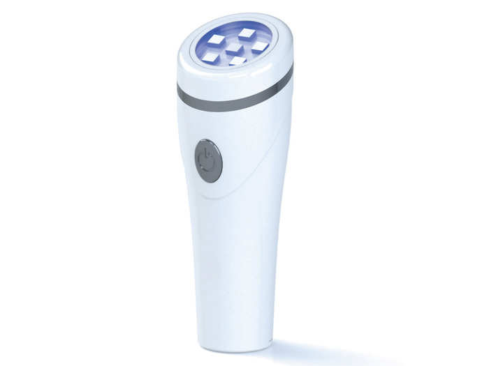 A travel-sized light therapy acne treatment