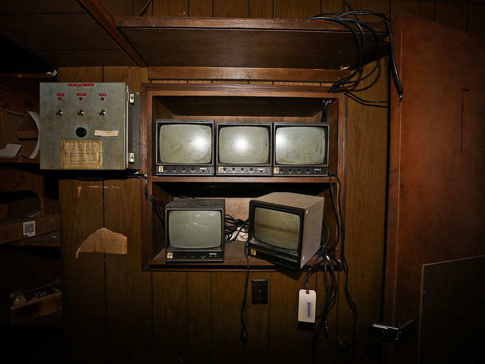 When the building was abandoned in 1993, the retail giant left behind old television sets, record players, and name tags.