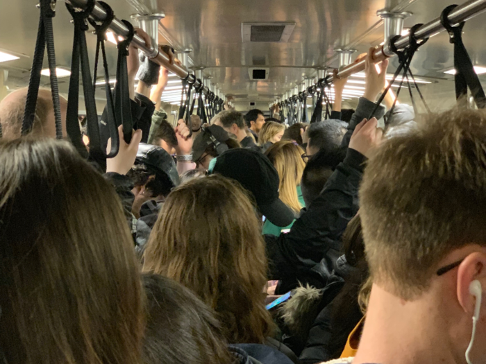 As usual the train is crammed full of passengers, with only standing room available.