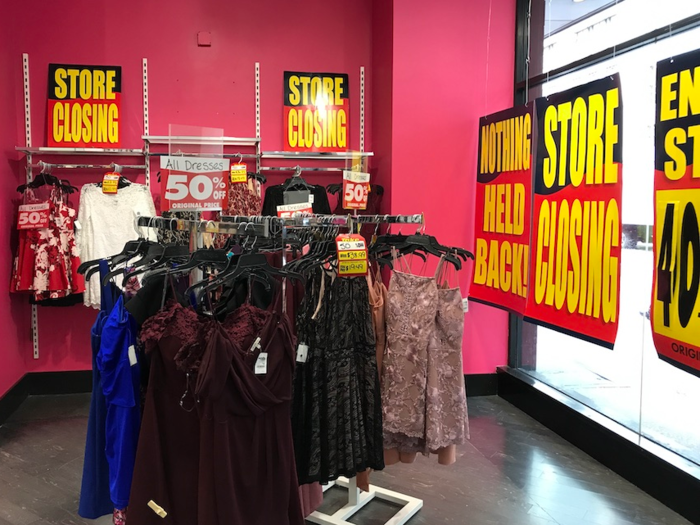 Clothing racks were marked with large signs informing customers of the 40% to 60% discounts.