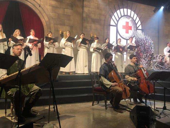 The choir forms the centerpiece of the experience, performing an original, 27-minute composition inspired by Game of Thrones throughout the donation and pinning ceremony. The music elevates the experience like no other.