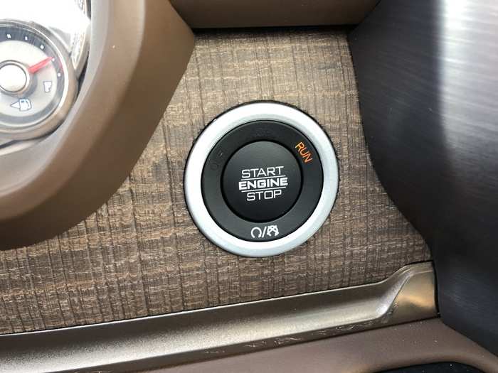 In the midst of some beautiful textured wood trim we find the stop-start button.