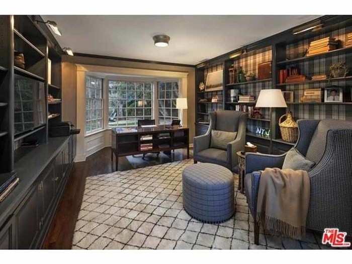 ... a dining room and library with dark gray wood interiors ...