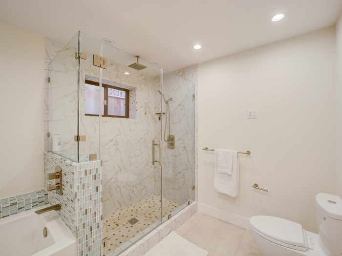 The master suite comes with a spa-inspired bathroom complete with a rainfall shower.