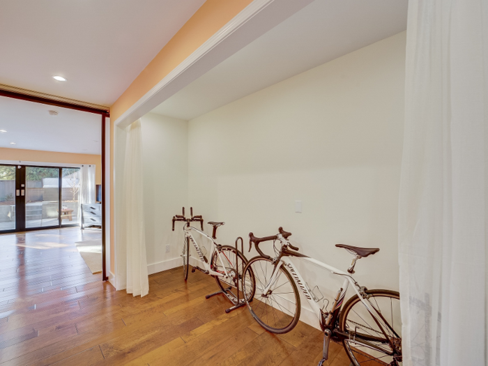 ... the closet space in the master suite is being used to store his two bicycles.