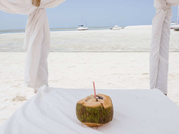 Shortly after sitting down, a Kilindi bartender brought over a freshly cut coconut. You can order just about anything you want at the beach, but I was only looking for hydration.