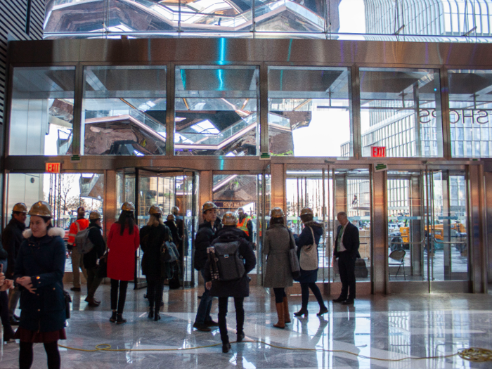 Just outside the main entrance of the shops and restaurants is Vessel, Hudson Yards