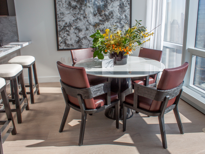 Bar stools and a separate breakfast nook provide additional eating areas.