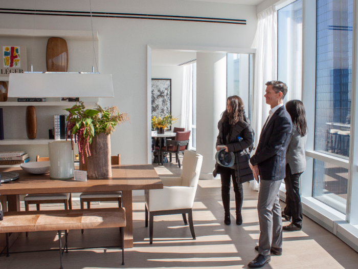 To the right of the dining table is the entrance to the eat-in kitchen.