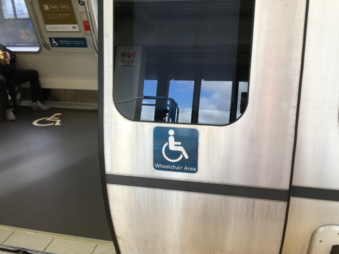 There is a dedicated entrance in each car for wheelchairs. This door has an insignia, like the bike entrance, to help wheelchair users better navigate the train entry.