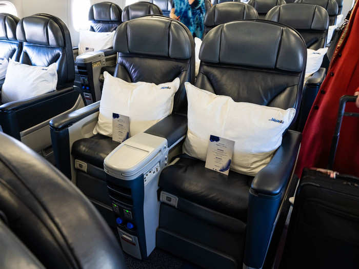 Each seat — which could recline far back and had foot and leg rests — had a large pillow, warm blanket, and custom in-flight menu waiting on it.