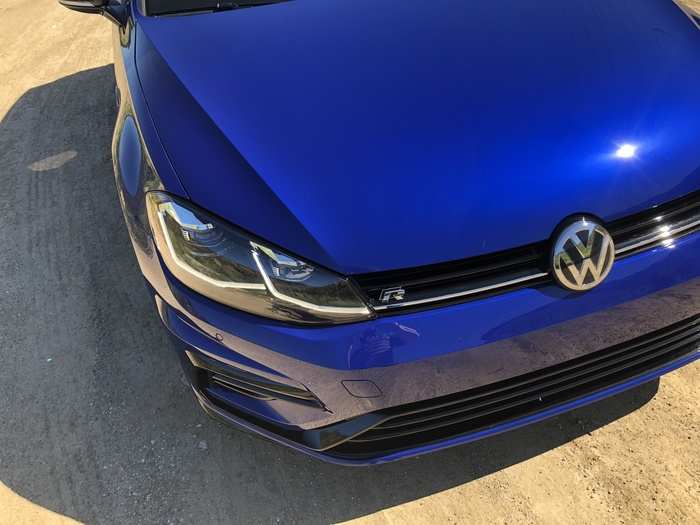 The LED headlights frame a VW logo that hasn