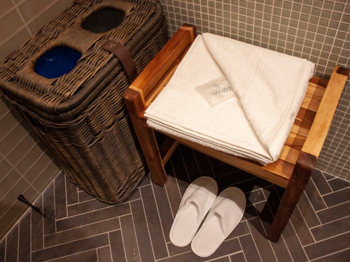 Each private shower is supplied with a towel and a pair of slippers.