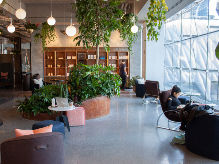 My first thought upon stepping inside the space was that the abundance of plants and light do give it a "Garden of Eden" vibe. The plant-filled lounge includes work spaces, Casper nap pods, private showers, a meditation room, soundproof photo booths, and coffee and snacks.