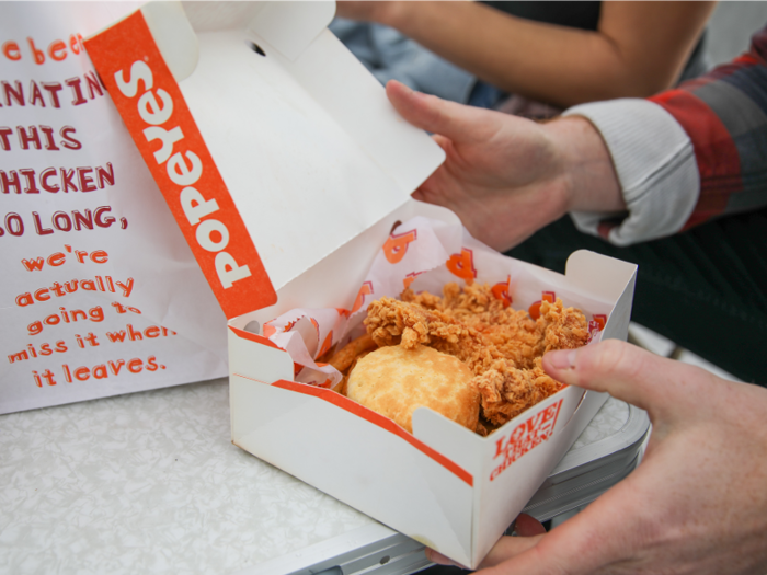 The contents of our meal, the fries, the chicken, and the biscuit, came packaged in a box with a wide opening.