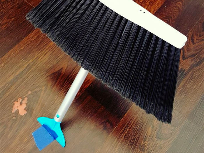 A broom that can both sweep and scrape