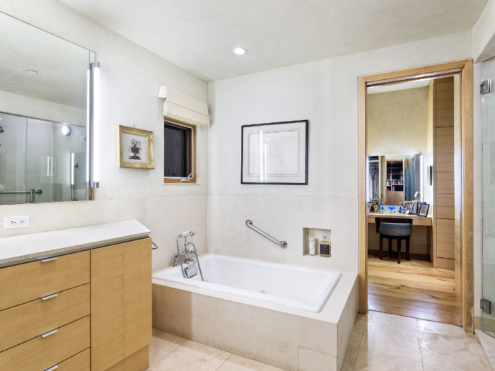 All five full baths include modern decorations and vary slightly in design.