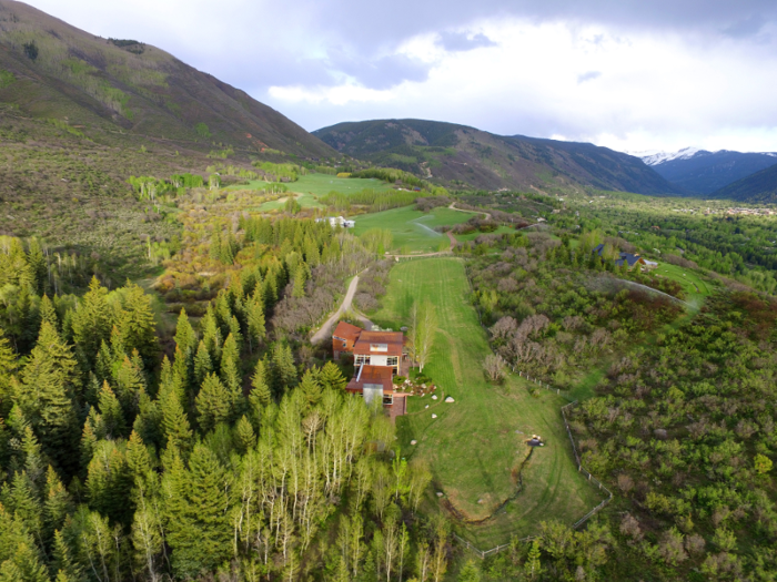 Nestled at the base of Red Mountain, the ranch is rather remote, though it is still accessible by road. The mansion overlooks the ranch