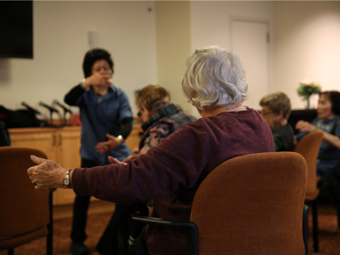 Participants were seated during the class, but attentive to their instructor, Janet.