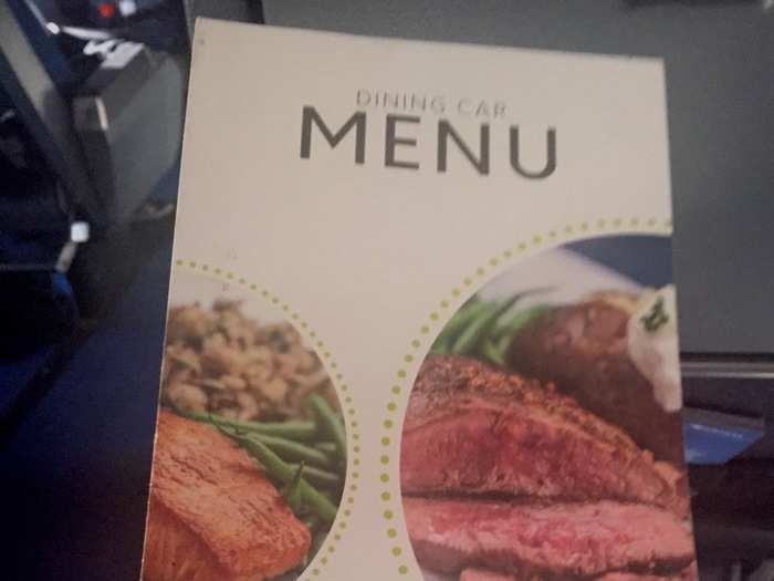 Then, a woman sitting a few rows behind us kindly passed over a dining car menu. I