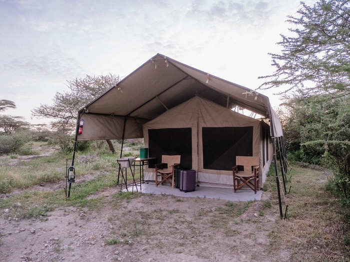 Each tent looks like this. There are a few camping chairs in front, a small washbasin so you can wash your clothes, and the tent itself.