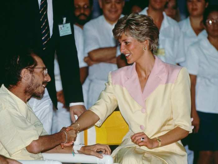 1991: Diana, Princess of Wales, made humanitarian history in moments like this one when she was pictured shaking hands with an AIDS patient without wearing gloves, breaking the misconceptions and stigma surrounding interactions with people with HIV and AIDS.