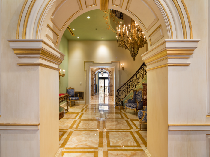 The formal entry hall has 14-foot ceilings.