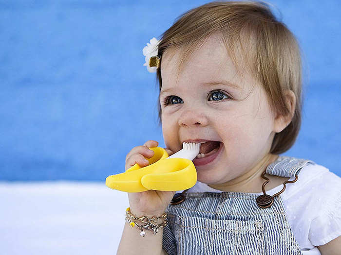 A cute toothbrush and teether to help them develop healthy habits