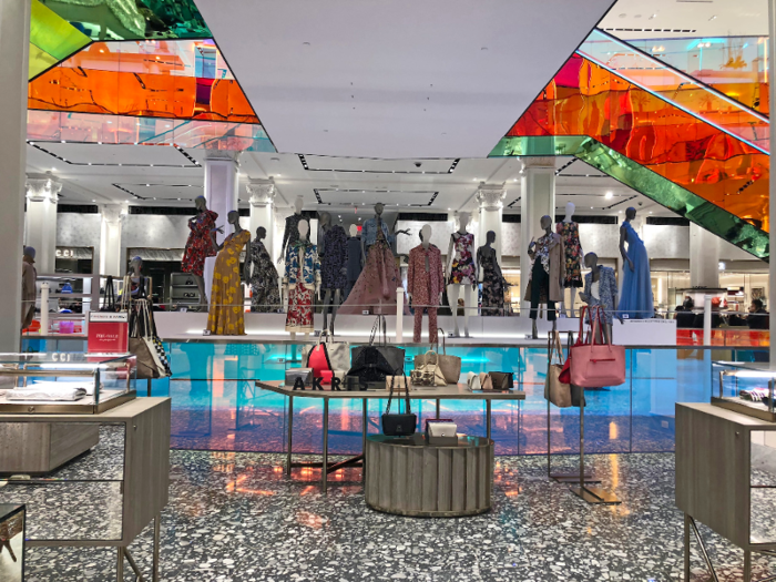 There was also a giant clothing and accessories display in the center of the floor, between two crossing escalators clad with rainbow, kaleidoscopic railings.