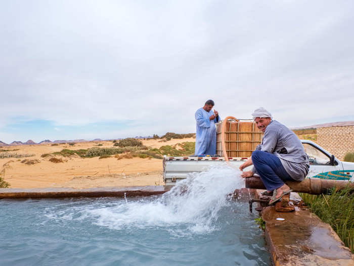 Before lunch, we stopped at another hot spring. The springs are fed into these irrigation basins before the water moves on through pipes to the fruit groves. Locals use the basins to cool off or warm up after work.