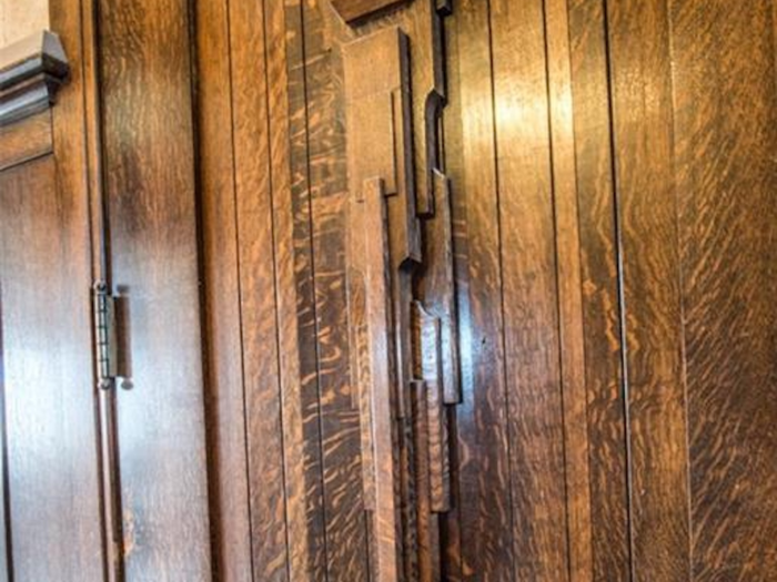 The 9-foot-high door is made of oak and weighs a whopping 400 pounds, according to the listing.