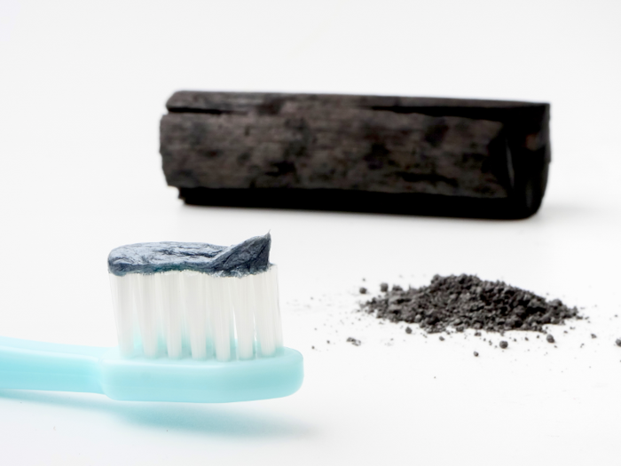 Use teeth whitening charcoal powder