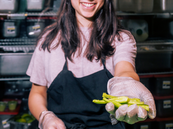 The peppers are then cut into slices about 1/4 inch wide — it