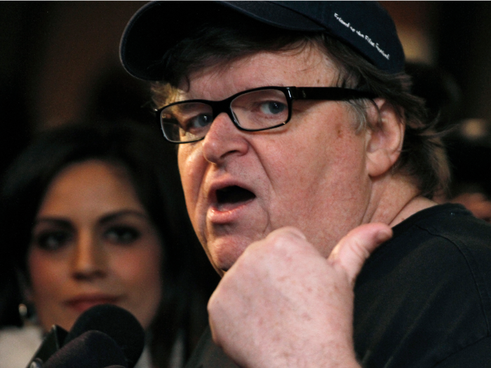 American documentary filmmaker Michael Moore played with Assange