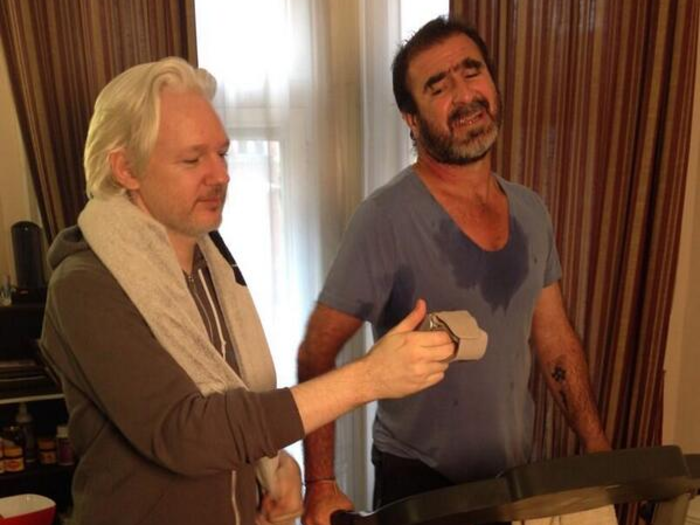 July 2014: Assange begins exercising with French soccer legend, Eric Cantona.