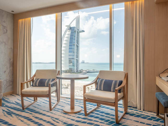 ... and a view of the beach and the Burj. It has a couch and a small seating area, but the room is only about 150 square feet.