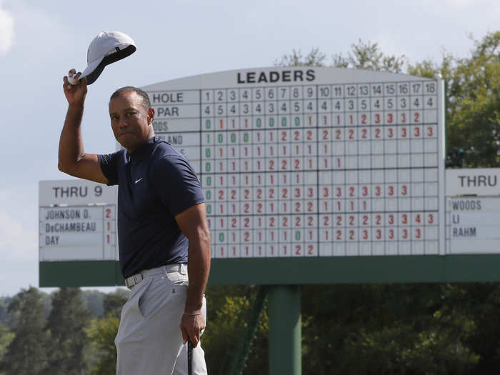 Tiger Woods salutes the patrons.