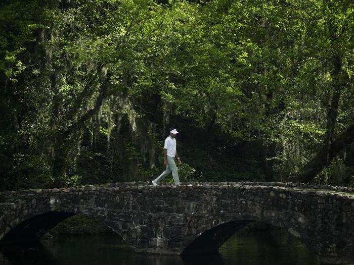 Bubba Watson crosses the bridge on 13.