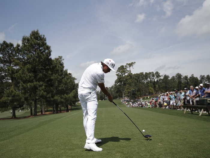 Rickie Fowler drives the ball during a practice round.