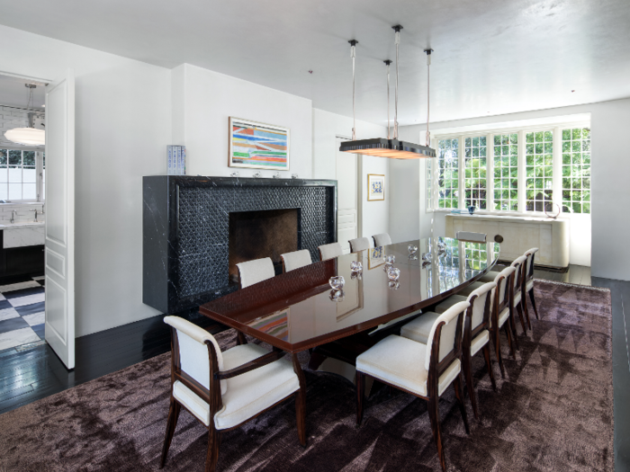 A marble fireplace anchors the dining room that can seat 20 people.