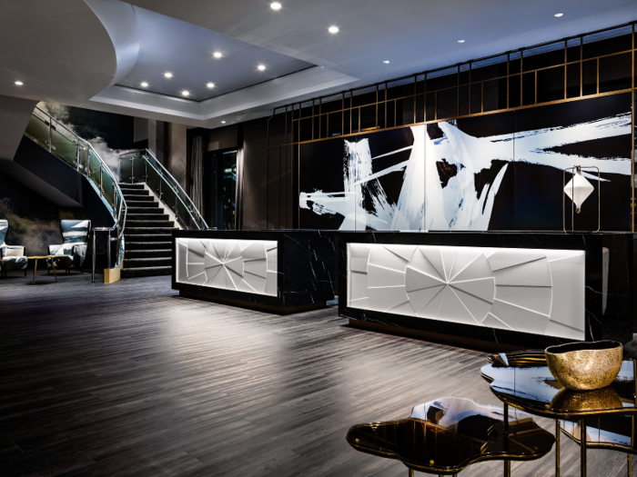 Guests check in at the modern reception desk, before heading upstairs to the top-floor suite.