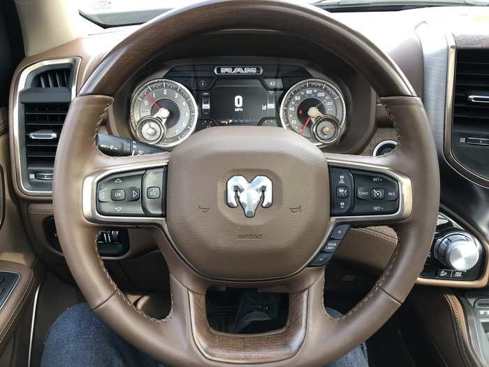 17. The trim on the gauges looks like tooled silver, the steering wheel has both leather wrapping and wood trim. The steering wheel is heated.