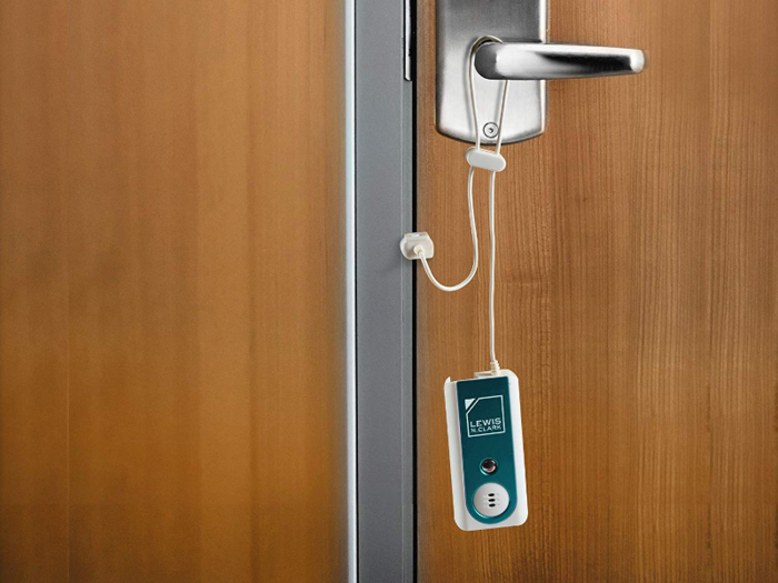 A travel door alarm