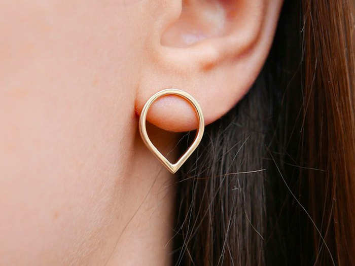 A minimalist pair of gold earrings